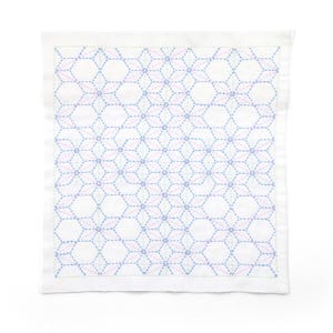 May include: A square white fabric cloth featuring a repeating geometric pattern created with blue and pink running stitches. The design consists of interconnected hexagonal and star-like shapes stitched across the entire surface of the textile.