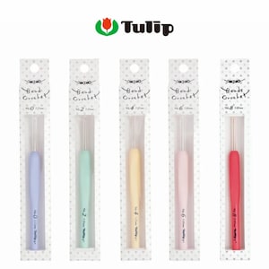 May include: Five Tulip Bead Crochet hooks in pastel colors: lavender, mint green, pale yellow, light pink, and red. Each hook is packaged in a clear plastic sleeve with the hook size and brand name printed on the handle.