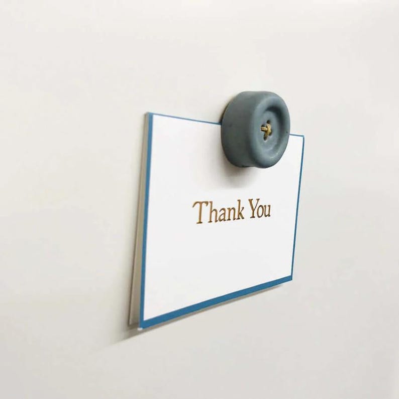 a thank you note attached to a refrigerator