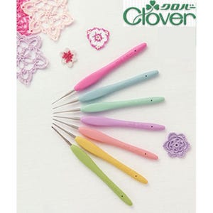 May include: A selection of crochet hooks with coloured handles in pink, blue, green, purple, yellow, and peach. The hooks are arranged in a fan shape, with the Clover logo visible. Crochet accessories are also present.