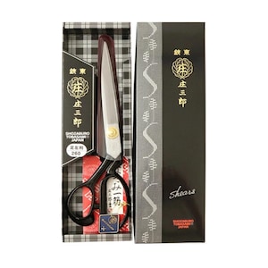 May include: A pair of black and silver shears in a decorative box. The box features Japanese text and the brand name "SHOZABURO TOBASAMI JAPAN". The shears are displayed in a black and white plaid pattern box with the text "Shears" on the side.