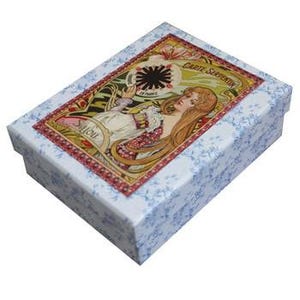 May include: Rectangular box with a floral design and a decorative image on the lid. The lid features a woman with long hair and the words "Carte Serpentin" in a decorative frame. The box has a blue floral pattern.