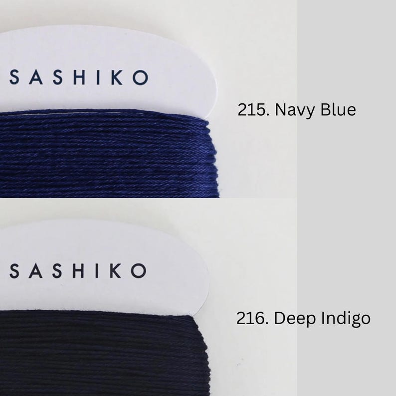 two spools of thread, each with a different color: navy blue and navy blue navy blue. The text above the spools indicates the color of the thread, with "SASHIKO" on the left and "215. Navy Blue" on the right. The text below the spools indicates the type of thread, with "SASHIKO" on the left and "216. Deep Indigo" on the right.