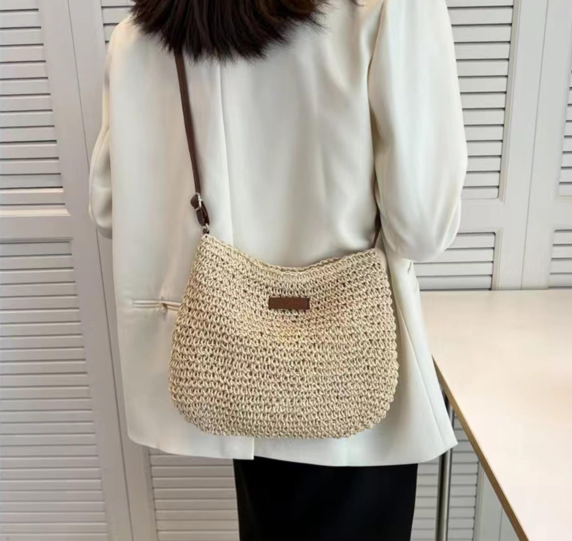 A beige woven leather shoulder bag, '80s, 22by30cm.
