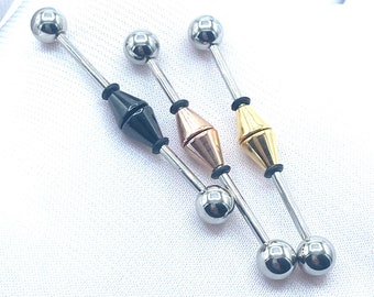 May include: Three silver barbell earrings with different colored accents. The first earring has a black diamond-shaped accent, the second earring has a rose gold diamond-shaped accent, and the third earring has a gold diamond-shaped accent.