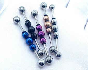 May include: Five silver barbell body jewelry pieces with different colored beads. The beads are black, blue, purple, and gold.