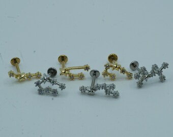 May include: Five gold and silver constellation-shaped body jewelry pieces with small clear rhinestones. The jewelry is in the shape of a constellation with stars.