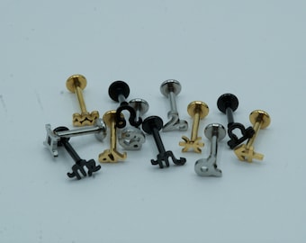 May include: A collection of 12 gold and silver zodiac sign body jewelry pieces. The jewelry is made of stainless steel and features a variety of zodiac signs, including Aries, Taurus, Gemini, Cancer, Leo, Virgo, Libra, Scorpio, Sagittarius, Capricorn, Aquarius, and Pisces.