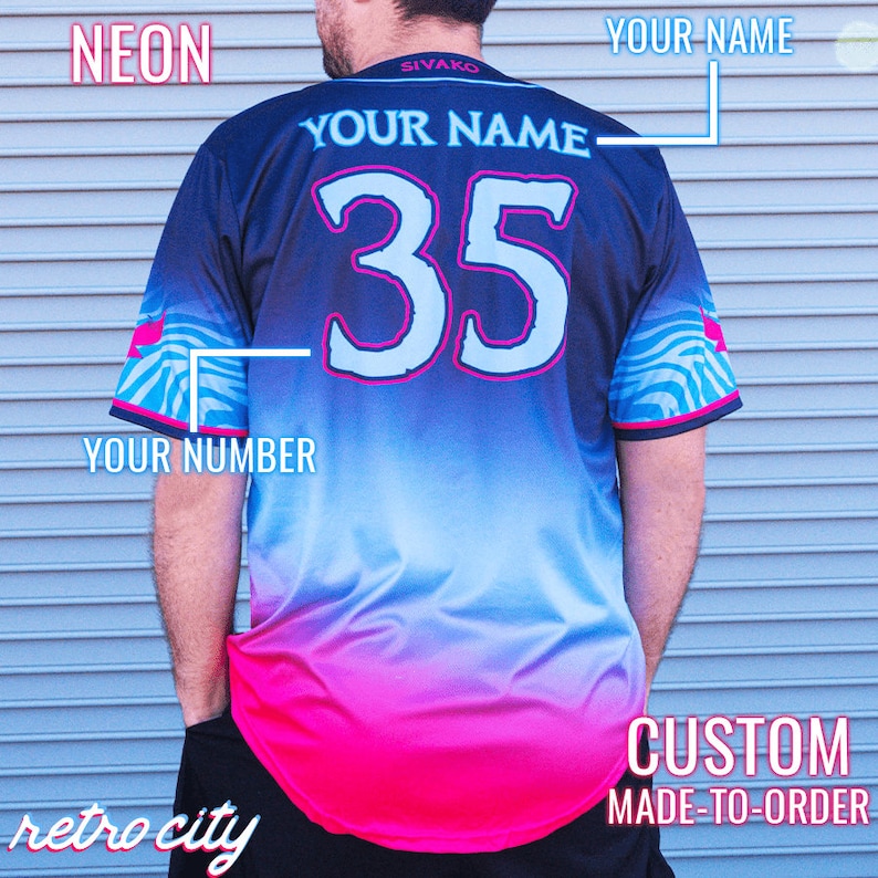May include: A black and blue baseball jersey with a pink and blue gradient design. The jersey has a white number "35" on the back and the text "YOUR NAME" above and below the number. The text "NEON" is in the top left corner of the image and the text "CUSTOM MADE-TO-ORDER" is in the bottom right corner of the image.