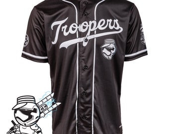 May include: Black baseball jersey with white trim and the word "Troopers" across the chest. Features a Stormtrooper helmet graphic and the text "CUSTOM MADE-TO-ORDER". The Retro City logo is visible in the lower left corner.