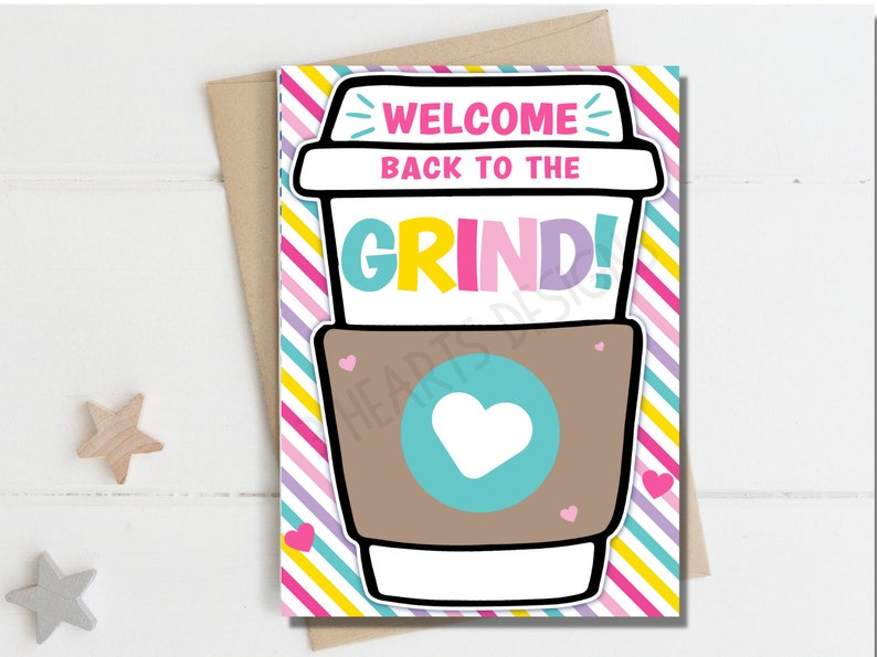 May include: A colorful card with a cartoon coffee cup illustration. The text on the card reads "Welcome back to the grind!"