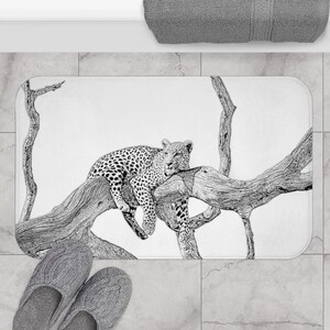 May include: Black and white illustration of a leopard resting on a tree branch. The leopard is drawn in a realistic style, with detailed fur markings. The tree branch is also drawn in detail, with bark and leaves.