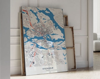 May include: A map of Stockholm, Sweden, printed on canvas and framed in a white frame. The map is a detailed illustration of the city's streets and waterways. The frame is not included.