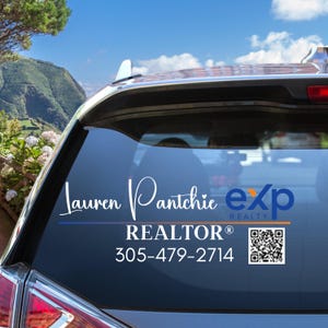 May include: A white car with a blue and white real estate sign on the back window. The sign says "Lauren Pantchie exp REALTOR&reg; 305-479-2714" and has a QR code.