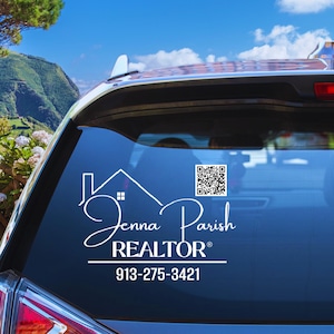 May include: White car window decal with a house icon, the text "Jenna Parish REALTOR®", a QR code, and the phone number 913-275-3421.