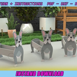 May include: Three grey French bulldog planter boxes with a light grey planter insert. The planter boxes are on a green grassy surface with a wooden bench and other planters in the background. The text "INSTAND DOWNLOAD" is at the bottom of the image.