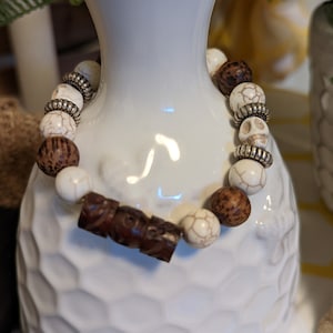 Stretchy bead bracelet, 10mm howlite bead, wood bead, howlite skull, silver spacers