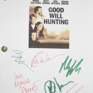 May include: A white script cover for the movie Good Will Hunting with the names of the actors Robin Williams, Matt Damon, Ben Affleck, and Minnie Driver printed on the cover. The cover features a photo of the actors and the title of the movie. The cover is signed by the actors in green and red ink.