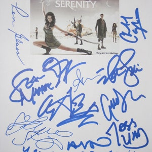 May include: A white print featuring the movie poster for "Serenity" with multiple blue signatures surrounding the poster. The poster shows a woman in a green dress holding a weapon, with other figures in the background. The text "They aim to misbehave" is visible.
