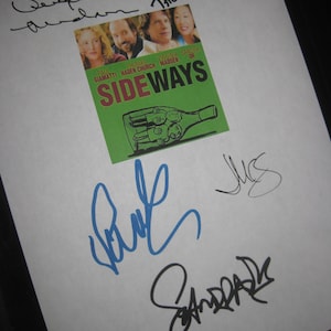 May include: A white sheet of paper with signatures from the cast of the movie Sideways. The signatures are in black, blue, and gray ink. The movie poster is in the upper left corner of the page. The poster is green and features a bottle of wine with a label that says "Sideways".