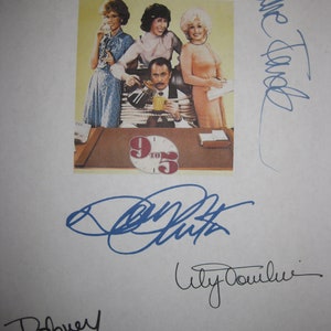 May include: A signed photograph of the cast of the 1980s television show "9 to 5". The cast members are Dolly Parton, Lily Tomlin, Jane Fonda, and Dabney Coleman. The photo is signed by all four cast members.