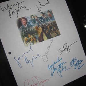May include: A white sheet of paper with multiple signatures in black, blue, and red ink. The signatures include "Winona Ryder", "Susan Sarandon", "Claire Danes", "Christian Bale", "Eric Stoltz", and "Laurie Metcalf". The signatures are on a white sheet of paper with a photo of the cast of the movie "Little Women" in the background.