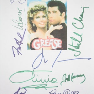May include: A signed Grease movie poster featuring John Travolta and Olivia Newton-John. The poster is signed by the actors, as well as the director, Randal Kleiser, and the producers, Allan Carr and Robert Stigwood.