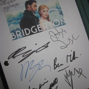 May include: A white sheet of paper with black ink signatures from the cast of the Netflix series Bridgerton. The signatures include: Julie Andrews, Jonathan Bailey, Simone Ashley,  Rege-Jean Page,  and  Phoebe Dynevor. The show's title, Bridgerton, is printed in black on the paper.