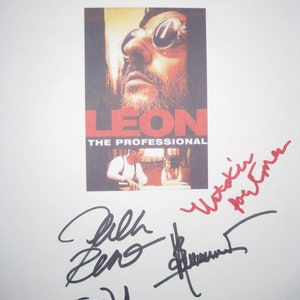 May include: A white poster with the title "Leon: The Professional" featuring a close-up of Jean Reno's face. The poster is signed by the actors Jean Reno, Natalie Portman, and Gary Oldman.