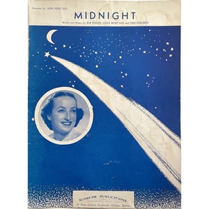 May include: A vintage sheet music cover for the song "Midnight" featuring a woman with a star-shaped comet in the background. The cover is blue with white stars and a crescent moon.