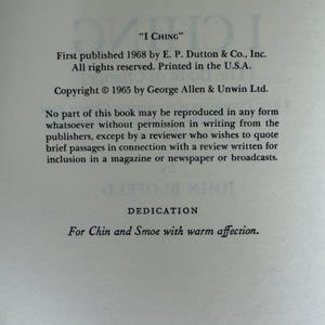 May include: A page from a book titled "I Ching". The text includes the publisher's information, copyright details, and a dedication "For Chin and Smoe with warm affection."