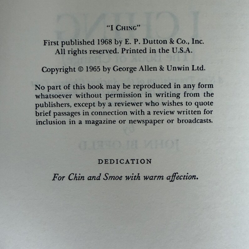 May include: A page from a book titled "I Ching". The text includes the publisher's information, copyright details, and a dedication "For Chin and Smoe with warm affection."