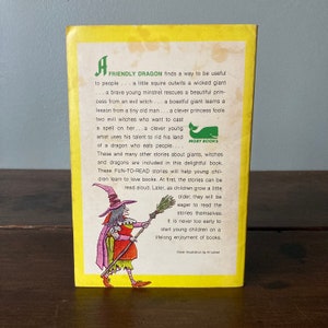 May include: A yellow book cover with a witch illustration. The book title is "A Friendly Dragon" and the text on the back cover describes the book as a collection of fun-to-read stories about dragons, giants, and witches.