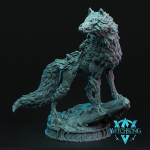 May include: A detailed, teal-colored wolf sculpture with intricate textures and a stylized design. The wolf stands atop a rocky base, with the text "Witchsong" visible at the base.