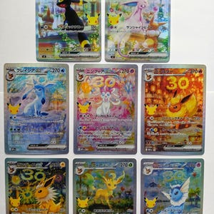 May include: A collection of eight Japanese Pokémon trading cards featuring Umbreon, Espeon, Glaceon, Sylveon, Flareon, Jolteon, Leafeon, and Vaporeon. Each card displays a holographic finish, character names in Japanese, HP values, and attack text.