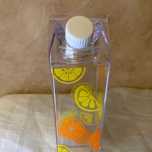 Lemon and orange slice milk carton water bottle