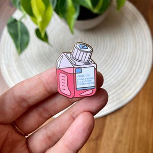 Media bottle enamel pin
