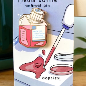 Media bottle enamel pin