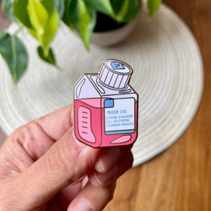 Media bottle enamel pin