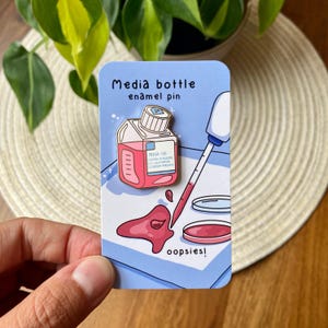 Media bottle enamel pin