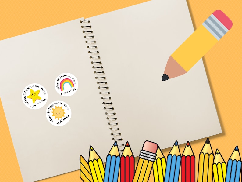 May include: Three round teacher reward stickers with a yellow star, rainbow, and sun. Each sticker says "Miss Wilkinson says" with a different phrase: "You're a Star", "Super Work", and "Well Done". A notebook with a spiral binding and a yellow pencil with a red eraser are in the background.
