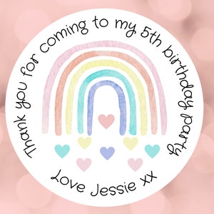 May include: Round white sticker with a rainbow design and the text "Thank you for coming to my 5th birthday party Love Jessie xx".