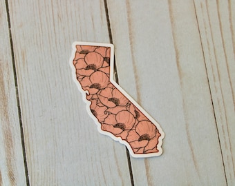 May include: A sticker of the state of California with a pink poppy flower pattern.
