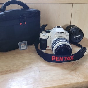 Price Reduced***Pentax K-x 12.4 Megapixal digital camera, with 18-5mm Pentax lense, and a Tamron 18-200mm telephoto lense, case and 2 - 32GB
