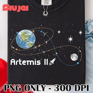 May include: Black sweatshirt featuring a graphic of Earth, the moon, and a rocket, with the words "Artemis II" in white. The design includes a space travel trajectory with numbered points and stars. The sweatshirt has a crew neck.