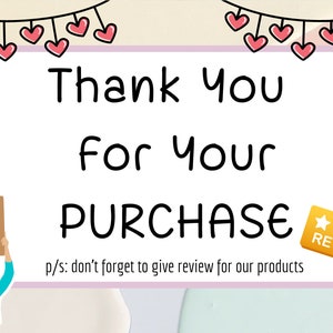 May include: A white card with a pink border and a black handwritten message that says "Thank You for Your PURCHASE" with a cartoon illustration of a person holding a sign that says "Thank you".  The card has a gold star rating sticker with the text "REVIEW US!" and a string of pink hearts hanging above the card.