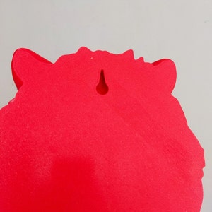 May include: Red, solid, foam, animal head wall decor with a hole for hanging.