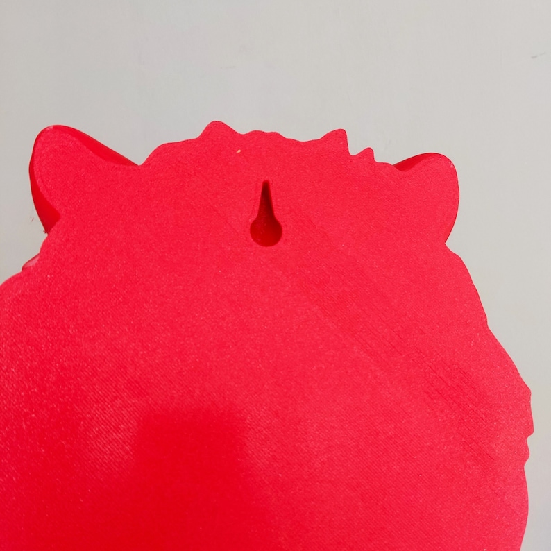 May include: Red, solid, foam, animal head wall decor with a hole for hanging.