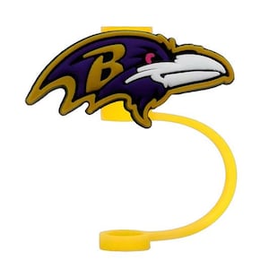May include: A yellow silicone bottle cap cover featuring a purple and black raven head logo with a gold letter B and a white beak. The design includes a flexible yellow tether attached to a circular ring base for securing the cap to a bottle neck.