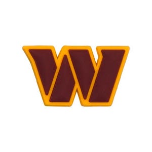 May include: A decorative charm shaped like the letter W, featuring a deep burgundy center with a thick, bright yellow border. The design has a flat, smooth surface and a distinct, bold geometric font style, creating a high-contrast appearance.